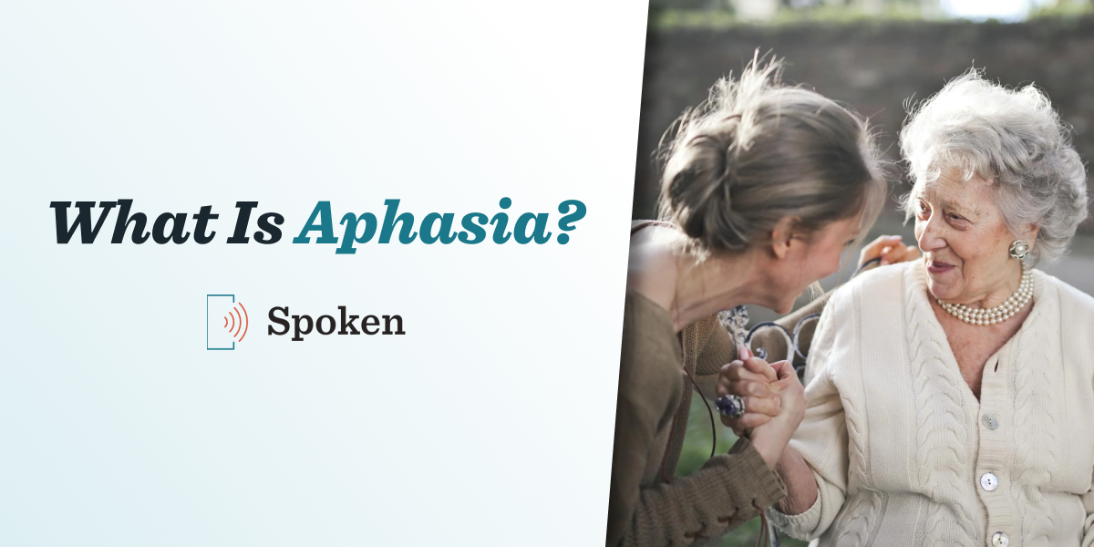 A photograph of an older woman and a younger woman communicating. Bold text to the left of the photo says “What Is Aphasia?” and the Spoken AAC logo is beneath it.
