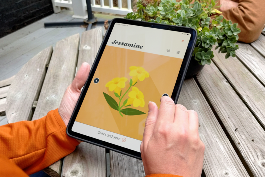 A closeup on a person thumbing through the voices available in Spoken. They are currently looking at Jessamine, represented by a vector illustration of vining flowers.